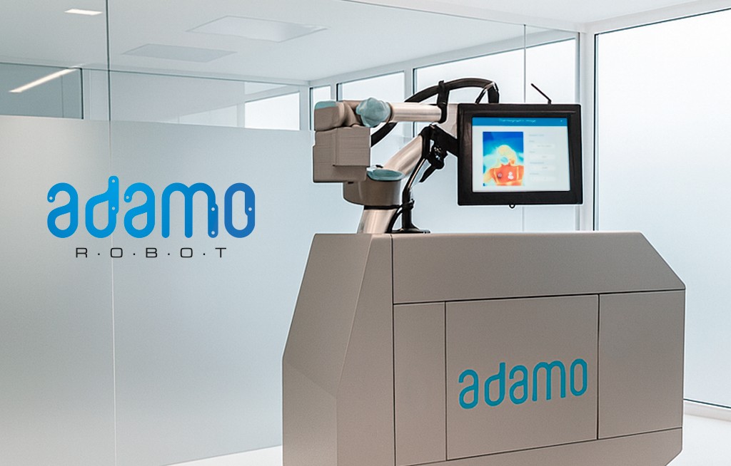 The Adamo robot in a clinic — branded mobile unit with a UR collaborative arm, touchscreen and pressurized-air nozzle